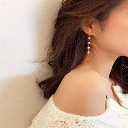 Long earrings with pearl tassels